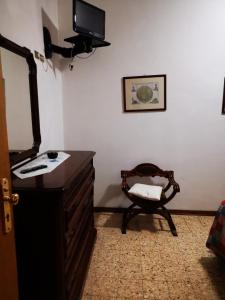 A television and/or entertainment centre at Osteria dei Locandieri