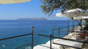 a view of the ocean from a balcony of a resort at Kaş Old Town Hotel in Kas