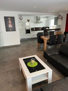 a living room with a couch and a table at Apartment Frank - bis zu 3 Schlafzimmer in Rust