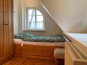 a bed in a room with a window at Haus am Meer in Nordstrand +14 photos