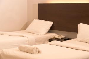 Postel nebo postele na pokoji v ubytování GM Hotel Metro at Sunway