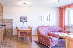 a living room with a couch and a table at Vogelsand 325 in Cuxhaven