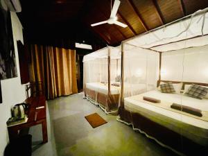 Letto o letti in una camera di Mango Tree House