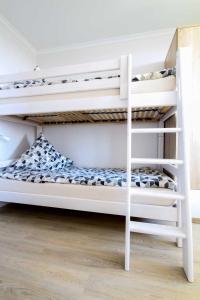 a white bunk bed in a room at Knechtsand 433 in Cuxhaven