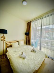 Postel nebo postele na pokoji v ubytování Hotel Perla