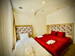 Postel nebo postele na pokoji v ubytování Hotel Perla