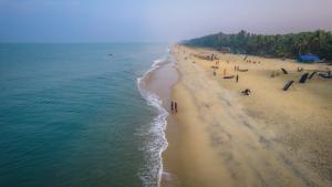 an overhead view of a beach with a group of people at Amritara A Beach Symphony in Mararikulam