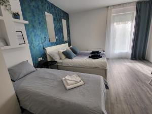 Postel nebo postele na pokoji v ubytování Apartmani Karlo