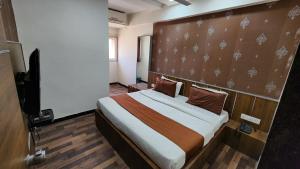 Rúm í herbergi á Hotel Nova Prime