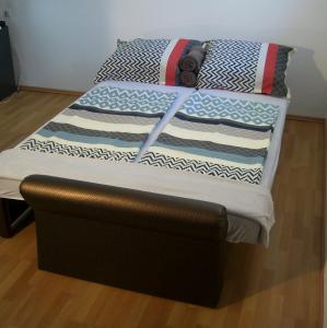 a unmade bed with at 2 STUDIO in Budapest