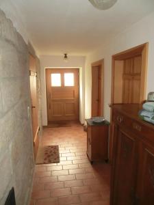a room with a door and a tile floor with a hallway at Ferienwohnung mit Charme in Dresden Pillnitz in Dresden
