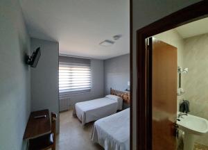 Voodi või voodid majutusasutuse Hospedaxe Don Manuel toas