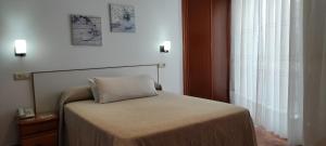 Łóżko lub łóżka w pokoju w obiekcie Hotel Grove