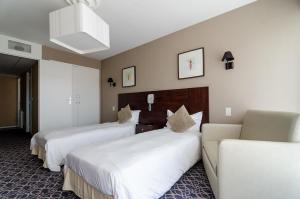 Postel nebo postele na pokoji v ubytování Hotel du Parc
