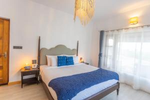 Letto o letti in una camera di Seclude Ramgarh Willows