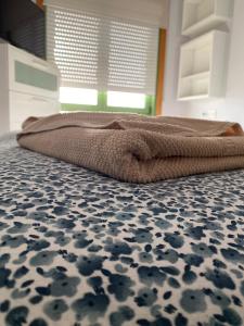 Posteľ alebo postele v izbe v ubytovaní Apartamento Chinijo