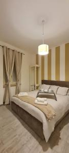 a large bedroom with a large bed in a room at La Casetta del Borgo in Caprarola