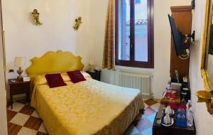 Postel nebo postele na pokoji v ubytování Luxury Venetian Rooms