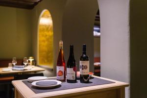 two bottles of wine sitting on a table at Eibsee Hotel in Grainau