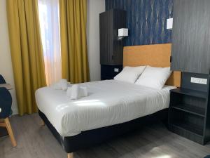 Giường trong phòng chung tại Hotel Le Cosy Riva Bella