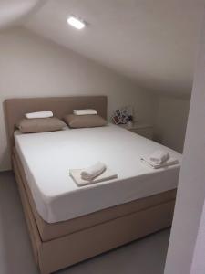 Postel nebo postele na pokoji v ubytování Apartments Villa Glavinić + 22 fotografií