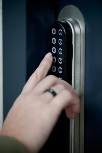 a person holding a door handle with their hand at Danhostel Vejle in Vejle