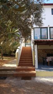 a set of stairs leading to a building at Apartments Nena 3* in Ližnjan
