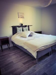Tempat tidur dalam kamar di A la Forge (proche d'Europapark)