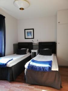 Letto o letti in una camera di Strand Hotell