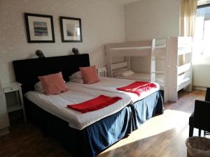 Letto o letti in una camera di Strand Hotell