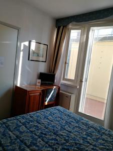 Letto o letti in una camera di Hotel Locanda del Passo Pomposa