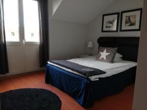 Letto o letti in una camera di Strand Hotell