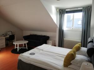 Postel nebo postele na pokoji v ubytování Strand Hotell