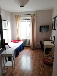 TV o dispositivi per l'intrattenimento presso Strand Hotell