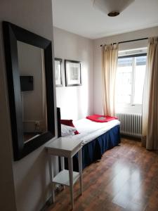 Letto o letti in una camera di Strand Hotell