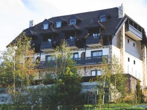 a building with balconies on the side of it at Divčibarski Vajati in Divčibare