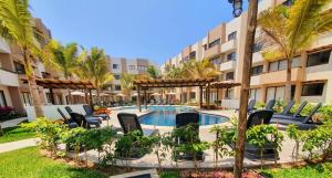 an image of a swimming pool at a resort at AMBAR BY HAUSING - Pet Friendly in Mazatlán