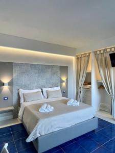 Un pat sau paturi într-o cameră la Casamediterranea