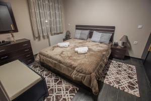 En eller flere senger på et rom på Efis guest house near Nafpaktos-Fully Equipped Home