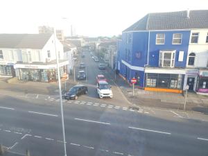 a view of a city street with cars and buildings at Topzy-Turvy - 1 Bedroom Apartment in Swansea