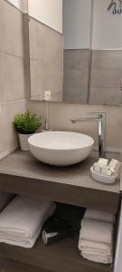 a bathroom with a large white sink on a counter at Casa Francesca e Rooms in Santa Maria di Castellabate +31 photos