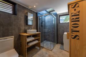 a bathroom with a shower and a sink at Apartment Lovely Rose with garden Jacuzzi in Jan Thiel +32 photos