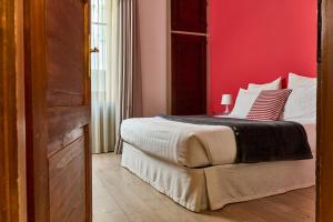 Кровать или кровати в номере Al Cavour 34