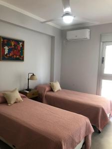 Ένα ή περισσότερα κρεβάτια σε δωμάτιο στο Dpto. premium, exclusivo zona puerto