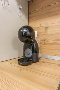 a black mixer sitting on top of a counter at KOA - NorthSide Apartment in Braşov