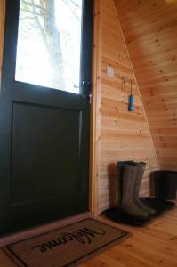 a door to a cabin with a mat in front of it at Riverside Retreat in Taunton