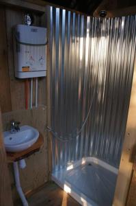 a bathroom with a shower and a sink at Riverside Retreat in Taunton