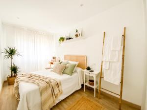 Ένα ή περισσότερα κρεβάτια σε δωμάτιο στο Apartamento Fufú by ALÔGA