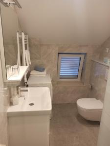 Koupelna v ubytování Peric Apartment West Dubrovnik + 16 fotografií