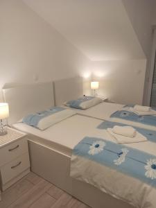 Postel nebo postele na pokoji v ubytování Peric Apartment West Dubrovnik